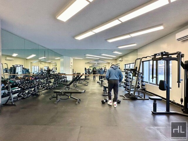 workout area featuring a wall mounted AC