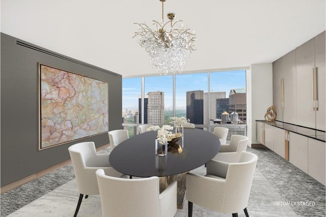 dining room featuring an inviting chandelier and a wall of windows