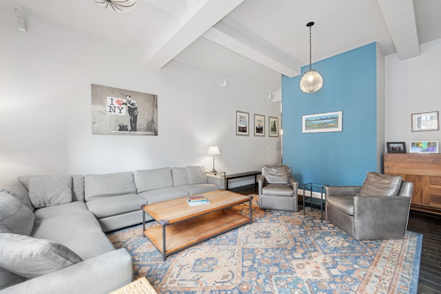 living room with wood-type flooring and beamed ceiling