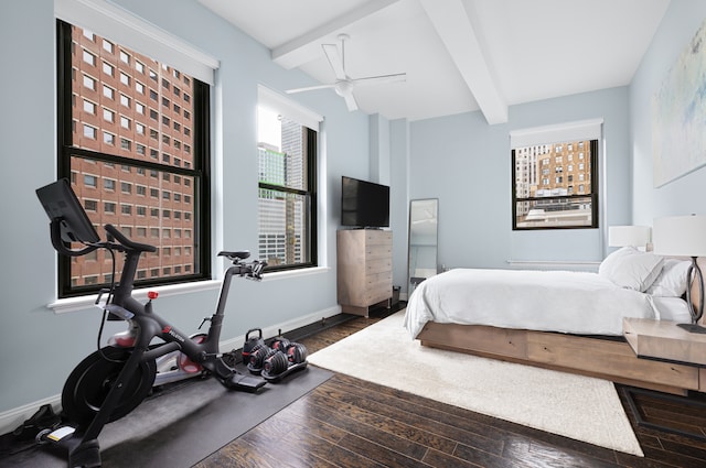 3 Hanover Sq Unit 13F, New York City, NY 10004 - bedroom featuring beamed ceiling, wood finished floors, baseboards, and ceiling fan