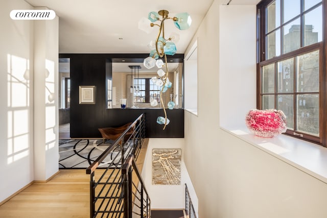 interior space with visible vents, baseboards, and wood finished floors