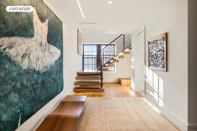 interior space with stairway and wood finished floors