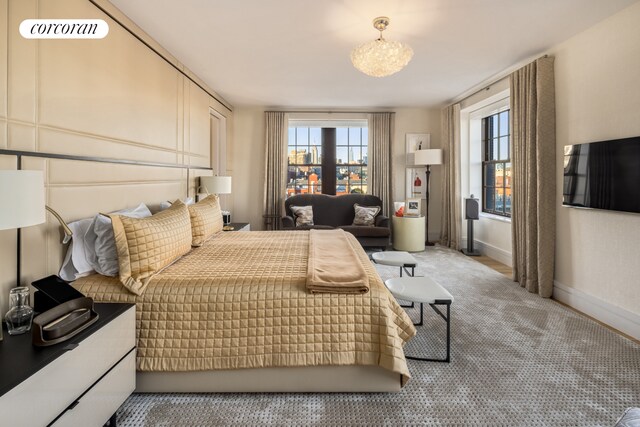 bedroom featuring a raised ceiling and hardwood / wood-style floors