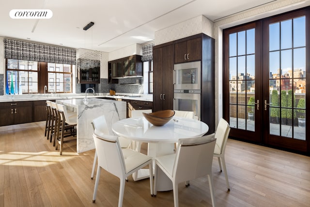 224 Mulberry St Ph, Ph, New York City, NY 10012 - dining area with french doors and light wood finished floors