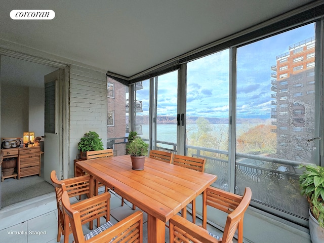 sunroom with a water view