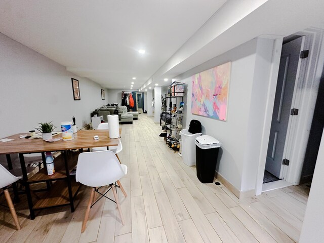 hallway with wood-type flooring