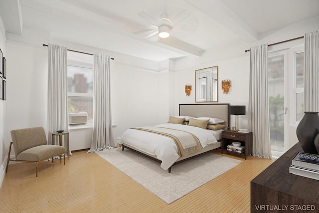 bedroom with ceiling fan, beam ceiling, and access to outside