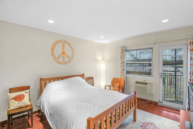 bedroom featuring access to outside, wood finished floors, and recessed lighting