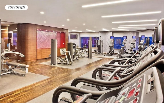 workout area with wood-type flooring