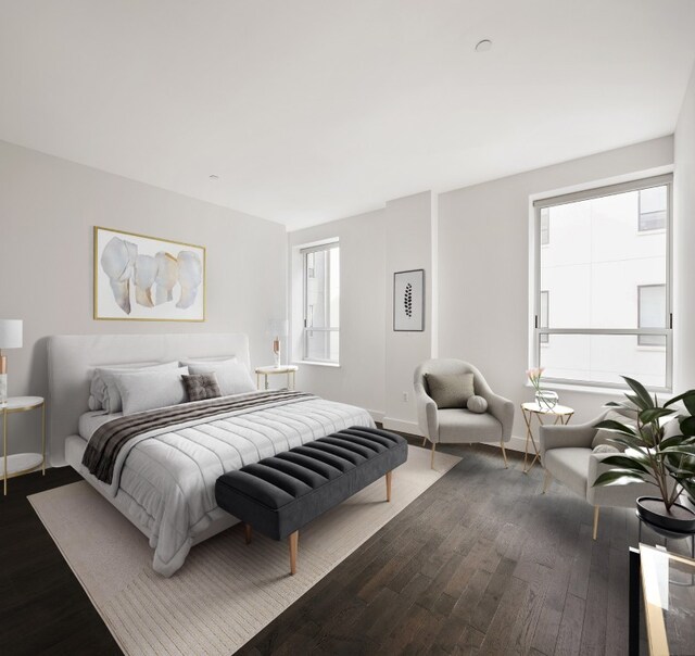 bedroom with dark wood-type flooring