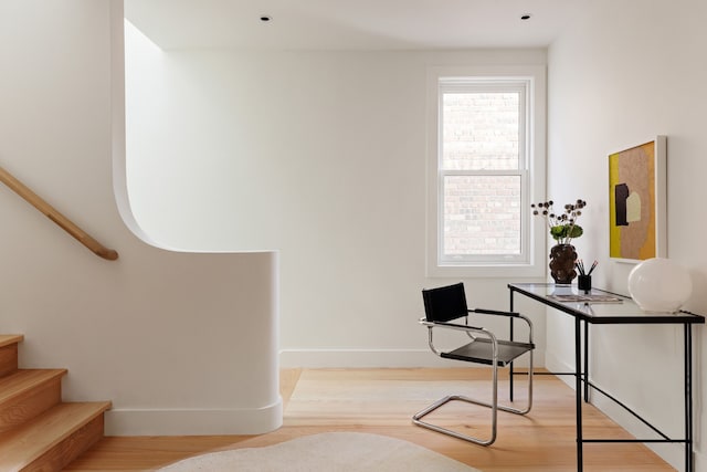 home office with wood finished floors and baseboards