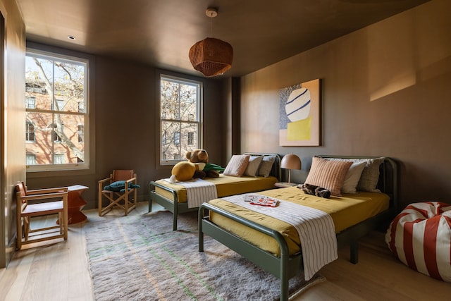 bedroom with wood finished floors