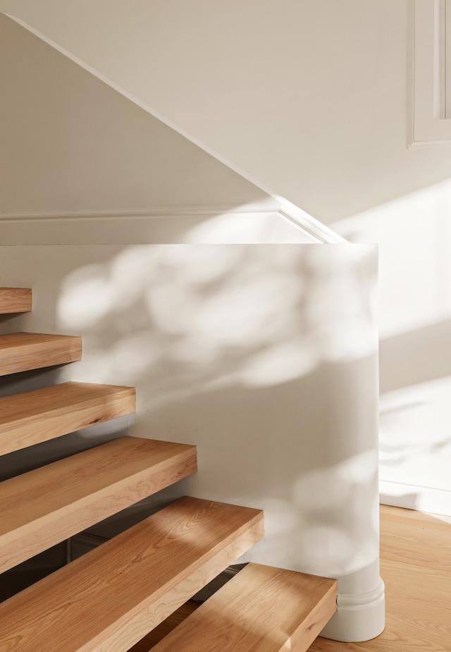 stairway with wood finished floors