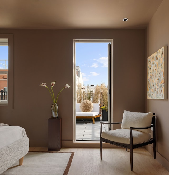 bedroom featuring wood finished floors and recessed lighting