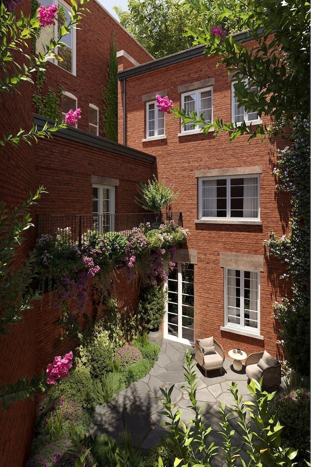 38 W 11th St, New York City, NY 10011 - back of house featuring brick siding and a patio