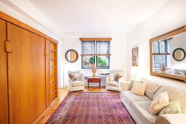 sitting room featuring light wood finished floors and a wealth of natural light