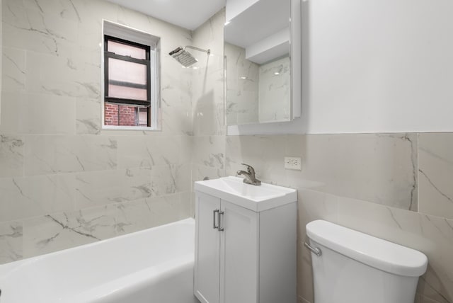 bathroom featuring toilet, shower / bathtub combination, tile walls, and vanity