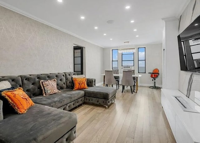 living area featuring recessed lighting, baseboards, crown molding, and light wood finished floors