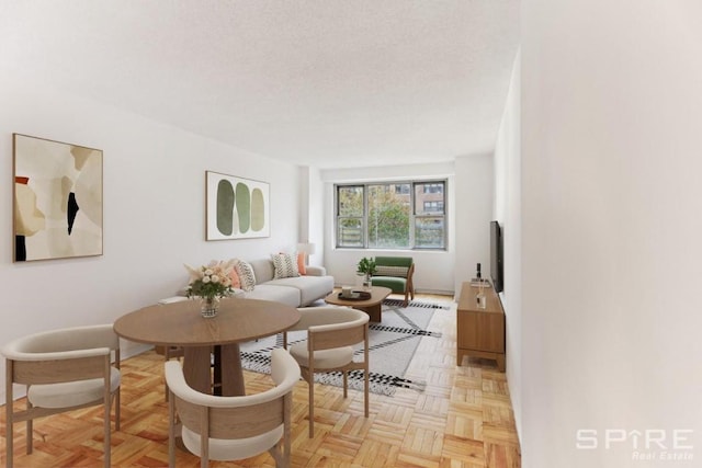 living room with a textured ceiling and light parquet floors