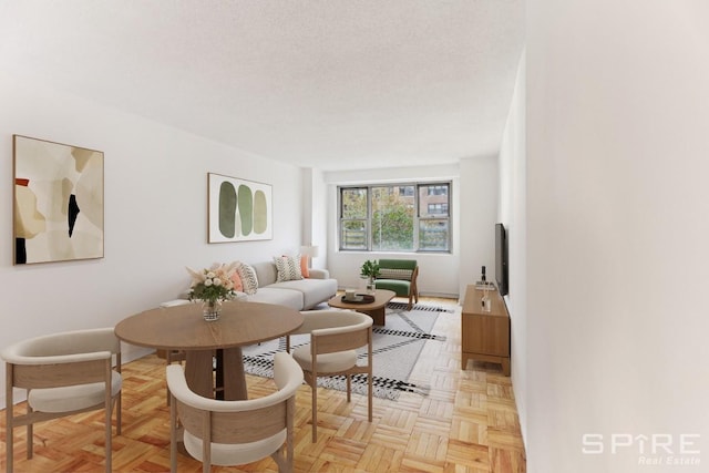 living area with a textured ceiling