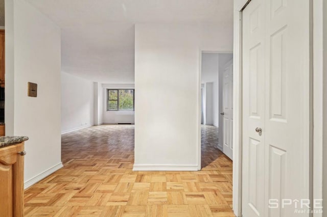 corridor with light parquet flooring