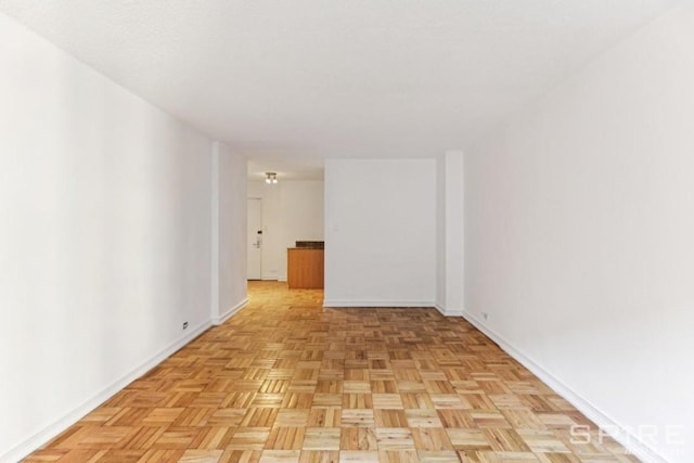 unfurnished room featuring light parquet floors