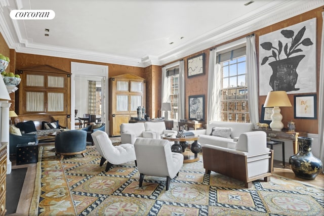 living room with hardwood / wood-style flooring and crown molding