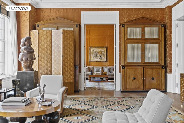778 Park Ave Unit 12Thfloor, New York City, NY 10021 - living area with crown molding, wallpapered walls, and a healthy amount of sunlight