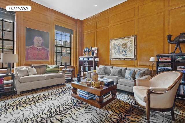 carpeted dining space with crown molding