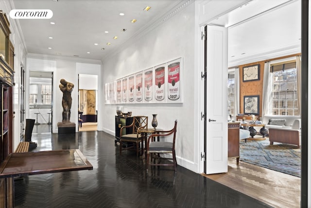 interior space featuring crown molding and dark parquet floors