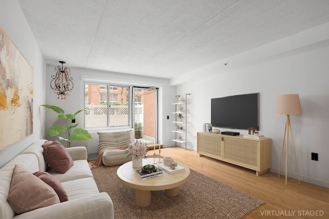 living room featuring hardwood / wood-style floors and a textured ceiling