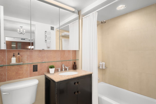 full bathroom featuring shower / tub combo with curtain, toilet, tasteful backsplash, tile walls, and vanity