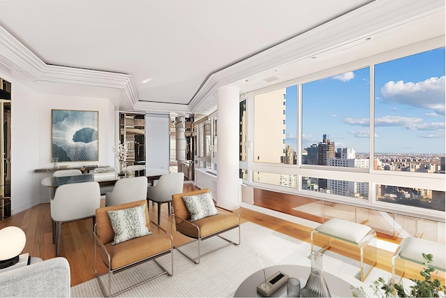 living area with wood finished floors and a city view