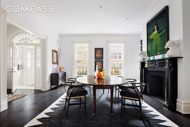 dining room featuring crown molding