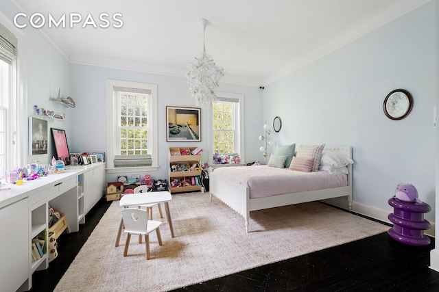 bedroom featuring dark wood-style floors, a chandelier, crown molding, and baseboards