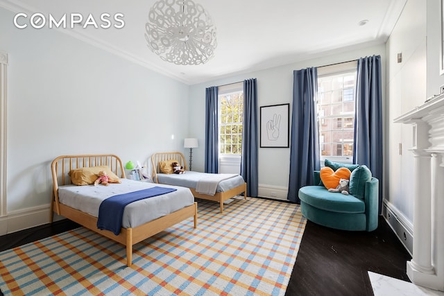 bedroom with crown molding and baseboards