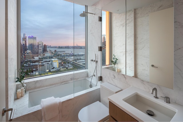 bathroom with toilet, a city view, vanity, tile walls, and a water view