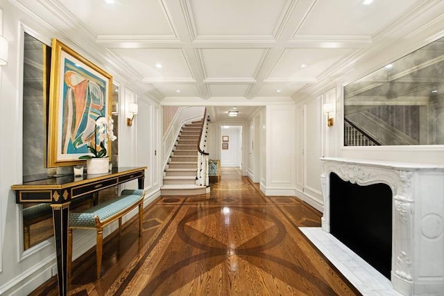 13 E 94th St, New York City, NY 10128 - hallway featuring inlaid floor details, stairs, and a decorative wall