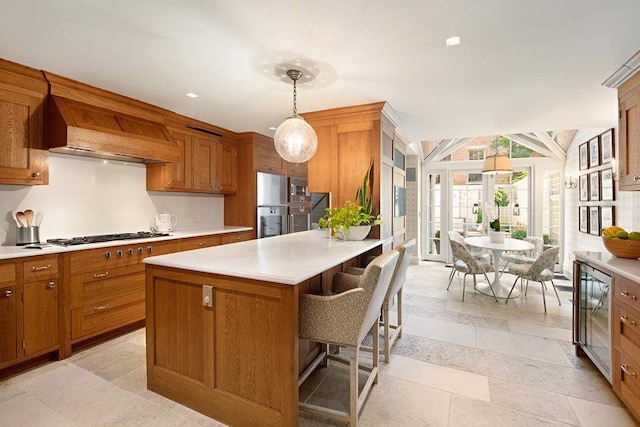 13 E 94th St, New York City, NY 10128 - kitchen with appliances with stainless steel finishes, brown cabinets, and recessed lighting