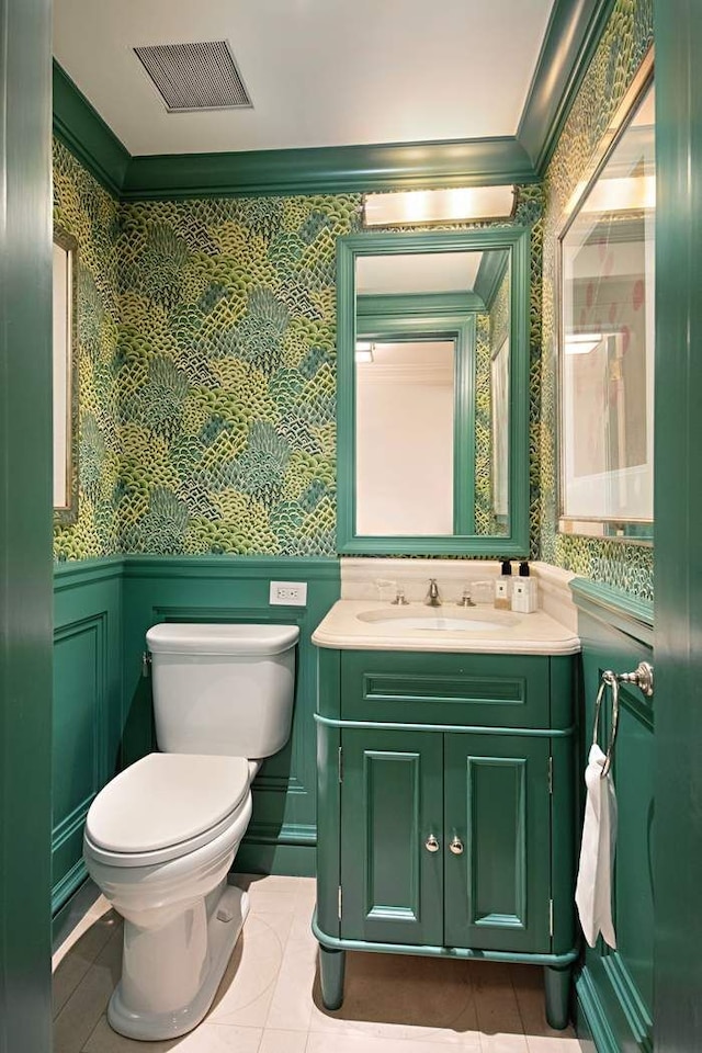 13 E 94th St, New York City, NY 10128 - bathroom featuring wallpapered walls, a wainscoted wall, vanity, ornamental molding, and tile patterned flooring