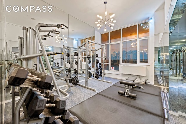 workout area with a notable chandelier