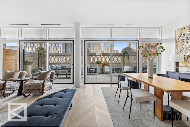 dining space featuring expansive windows and a view of city