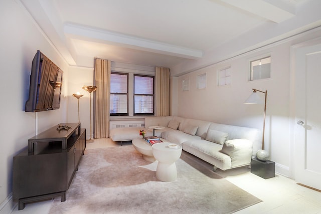 living room featuring beamed ceiling