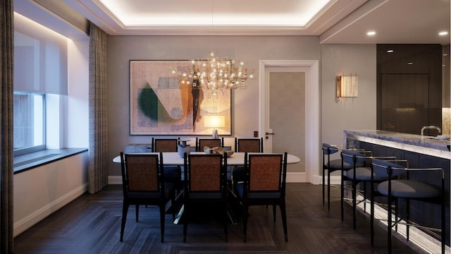 dining room featuring dark parquet flooring, a tray ceiling, and a chandelier