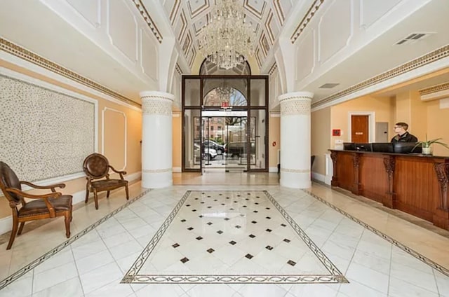 63-36 99th St Unit 8-D, New York City, NY 11374 - reception area featuring decorative columns, a towering ceiling, and a chandelier