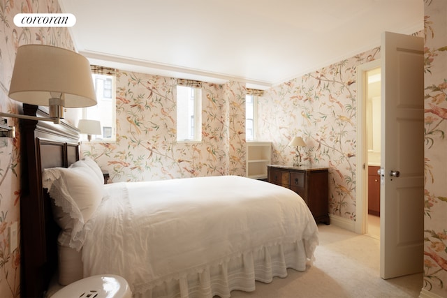 carpeted bedroom featuring crown molding