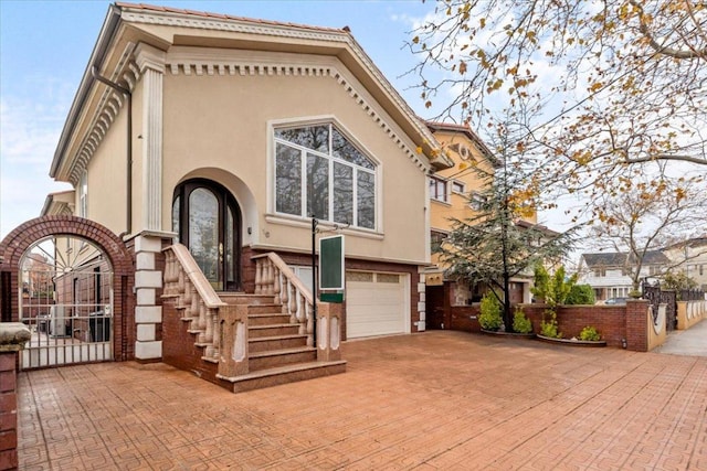 rear view of house featuring a garage