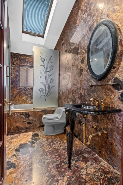 full bathroom featuring independent shower and bath, vanity, tile walls, and toilet