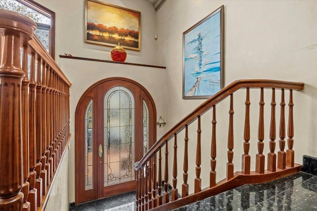 dining room with crown molding and a towering ceiling