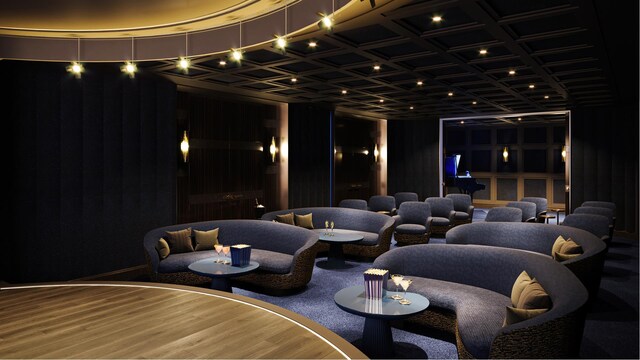 cinema room with hardwood / wood-style flooring